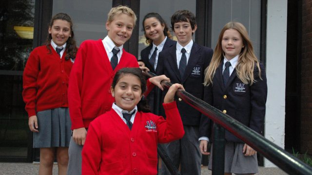 Westboro Academy students in uniform in front of school